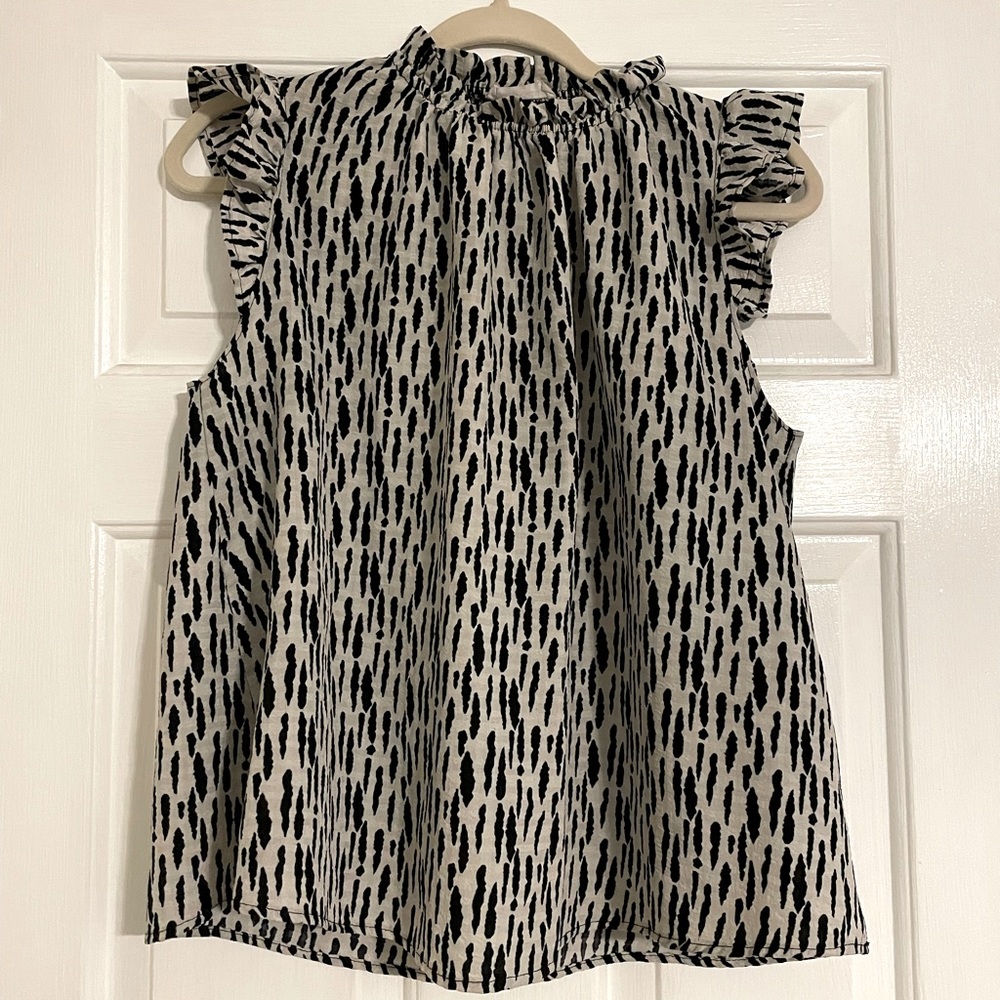Bucketlist Ruffle Sleeveless top